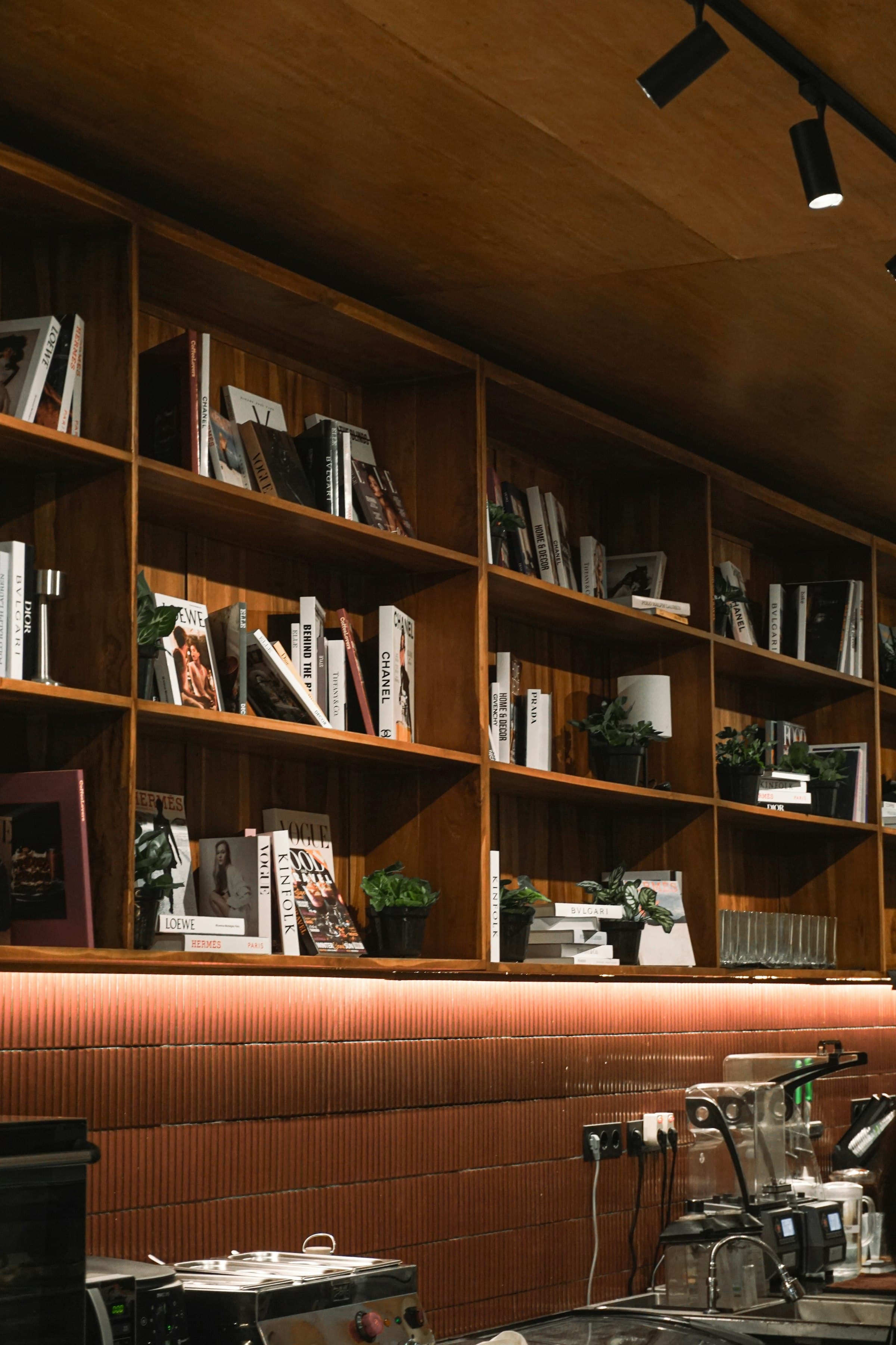 Shelves of books and knick-knacks along the back wall