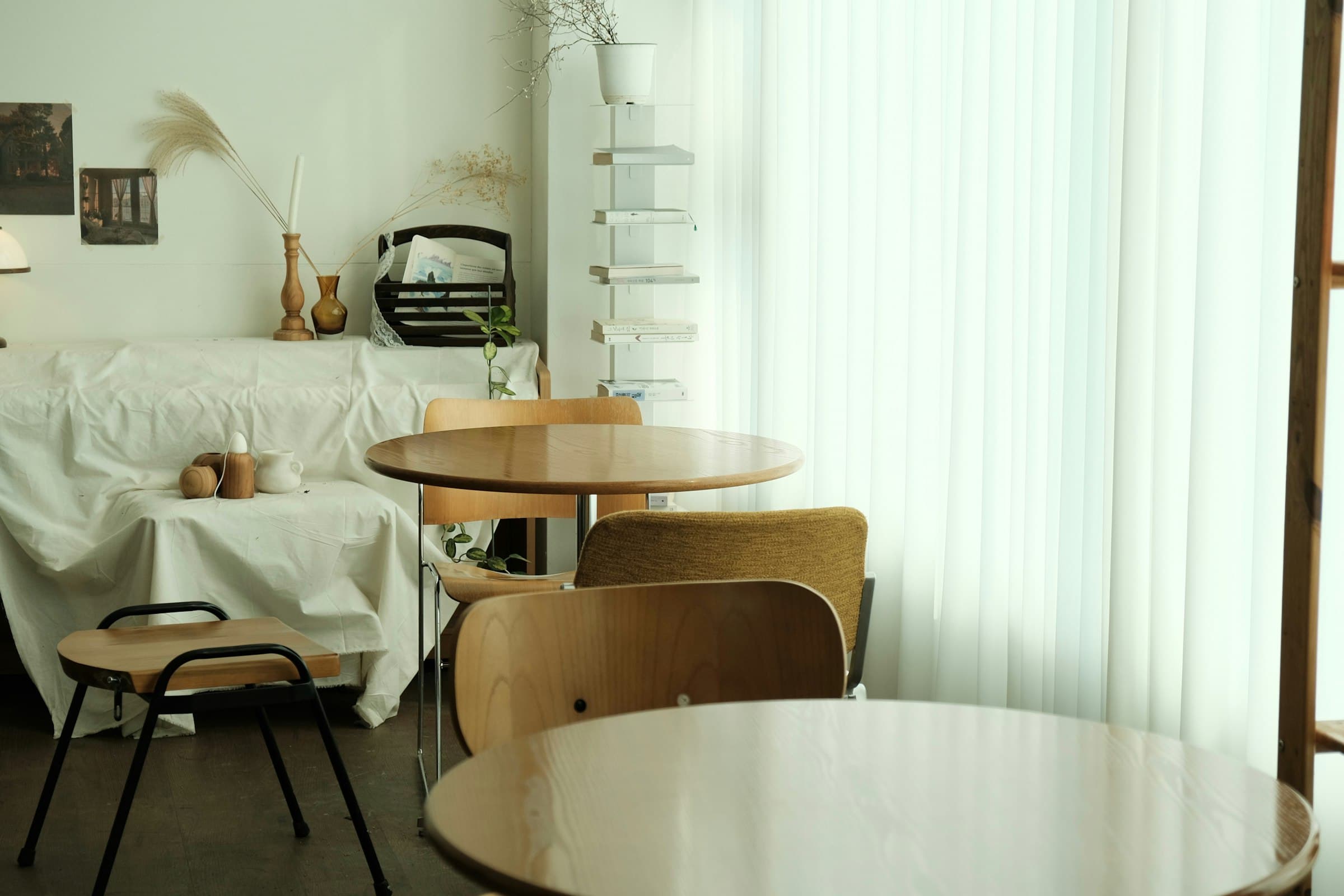 Empty tables in the cafe, bathed in soft window light